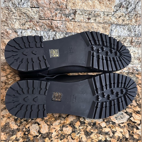 NWOB | Stuart Weitzman Black Leather Ryder Lift Gold Buckle Bootie - Picture 6 of 9